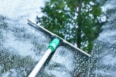 Simple instructions on how to clean windows with a window cleaner inside and out without streaks